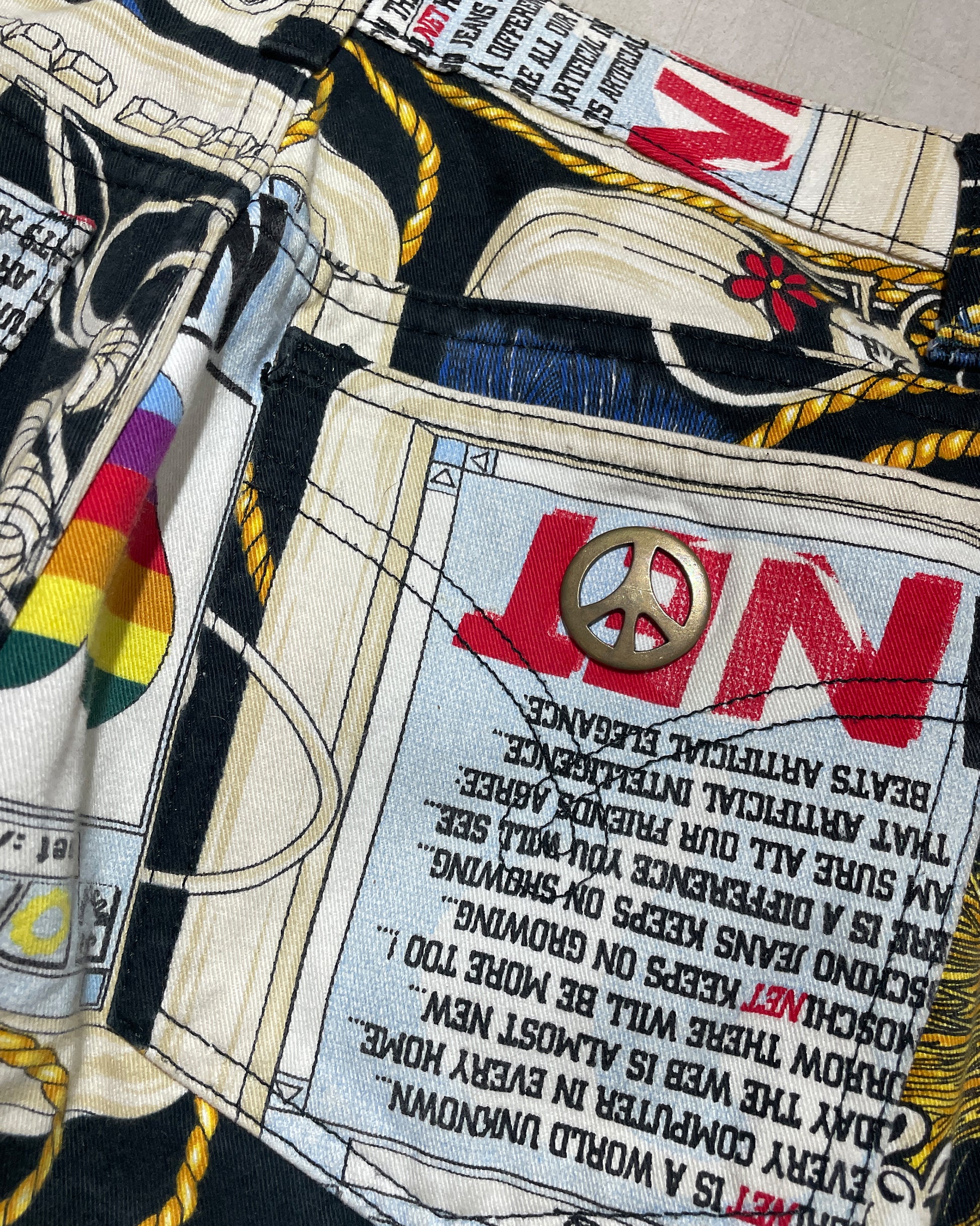 Close-up of Apple Computer print on vintage Moschino jeans 1995
