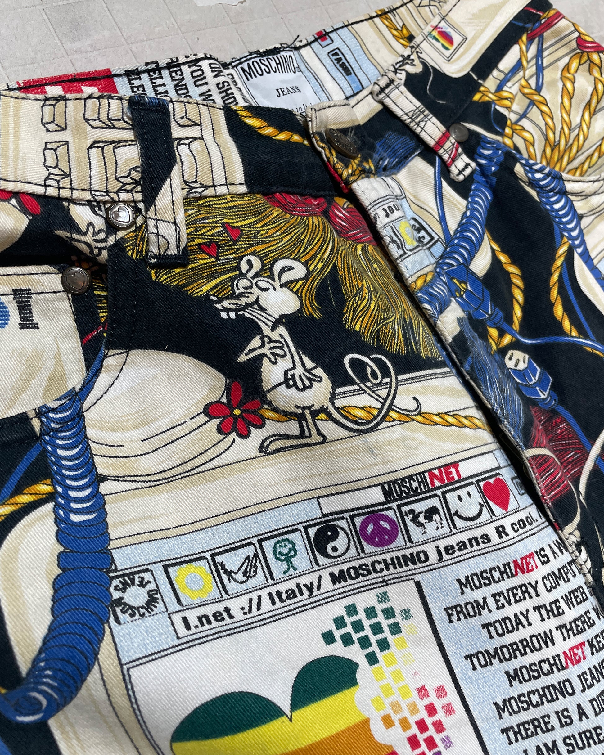 Close-up of Apple Computer print on vintage Moschino jeans 1995